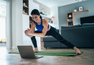 Woman doing some online fitness training.