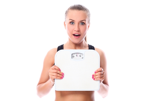 Woman worried about maintaining weight loss.