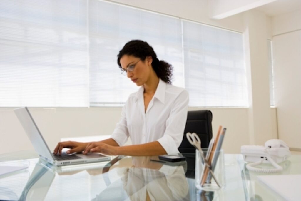 Corporate worker busy working on a corporate wellness guide.