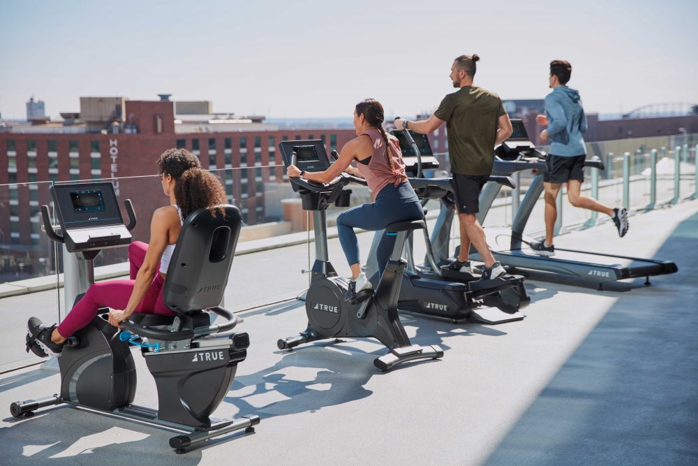 commercial cardio equipment on a rooftop facility.