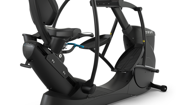 A black recumbent elliptical exercise machine with a seat, moving handlebars, foot pedals, and a large touchscreen display on the front. The brand name TRUE is visible on the seat and frame.