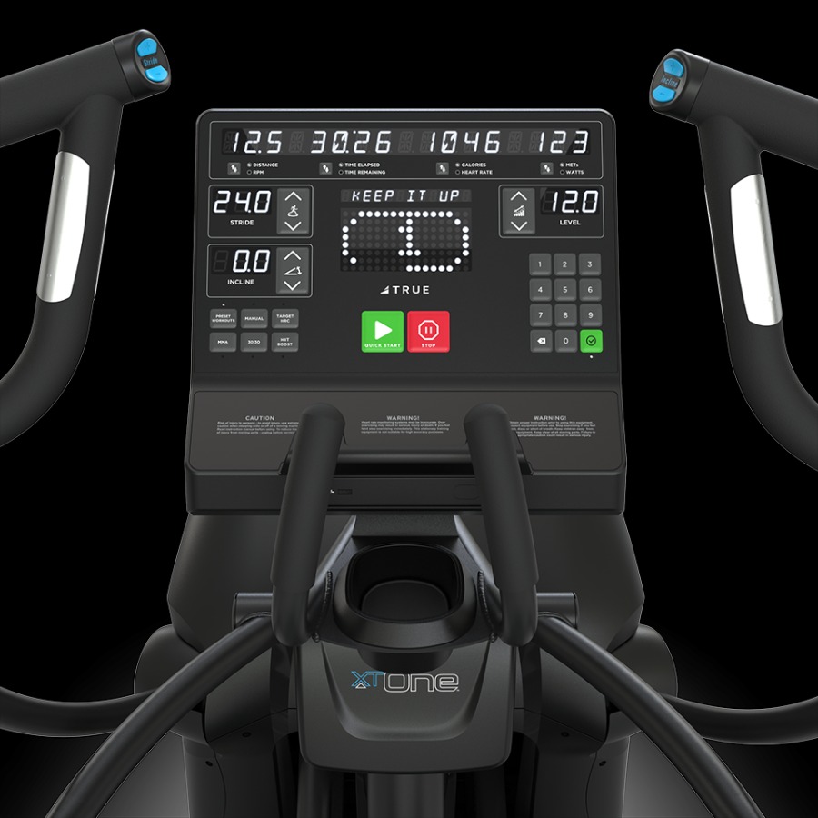 Close-up of a TRUE Fitness XT-One elliptical machine featuring a black LED console with workout metrics and controls.